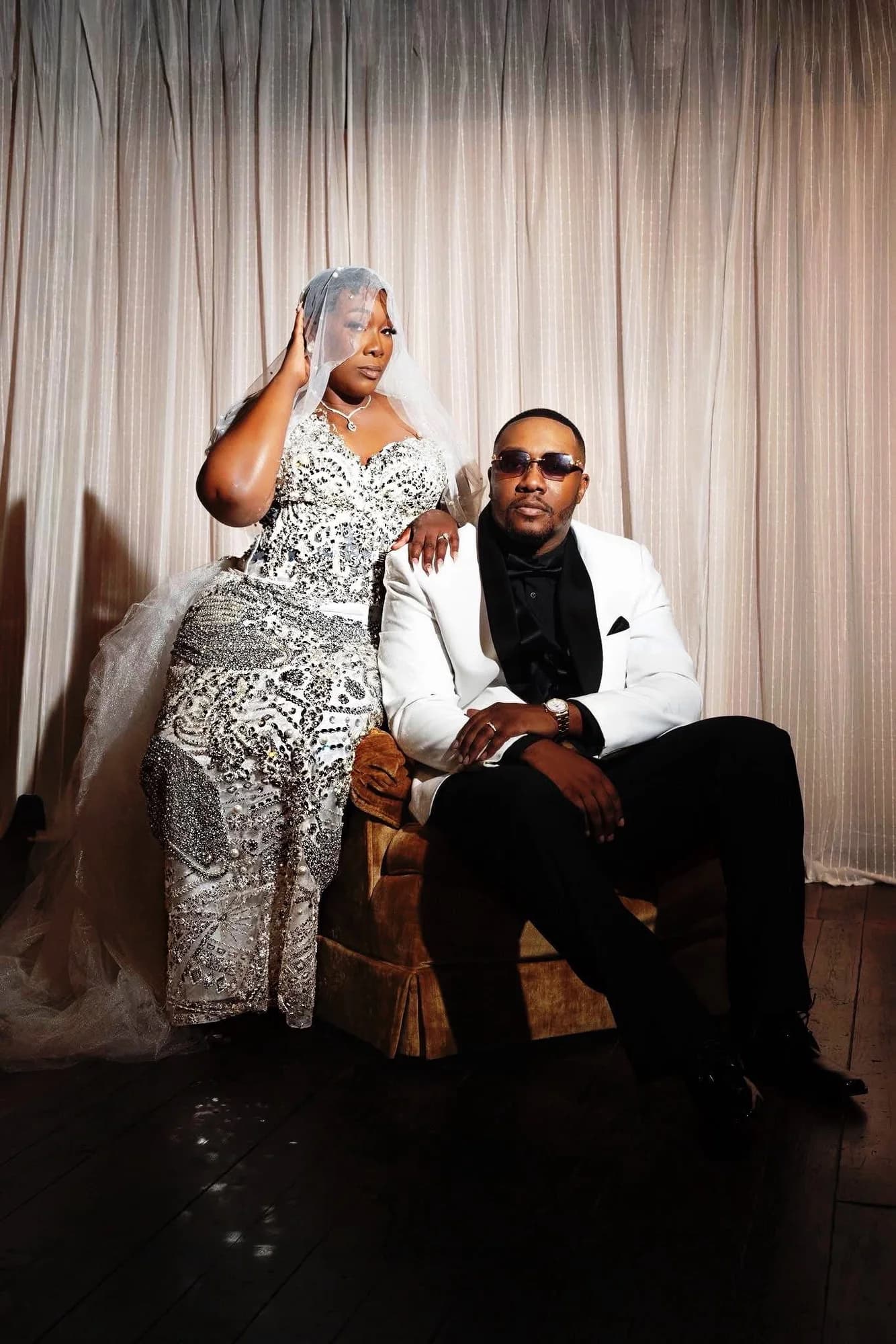 Bride in a crystal embellished gown standing beside her partner